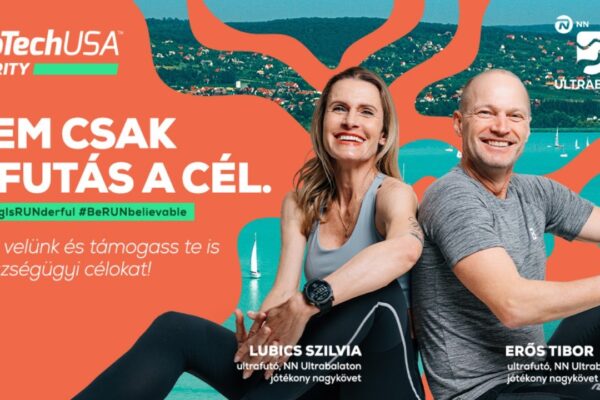 Narancssárga hátterű banner, bal oldalon a BioTechUSA Charity logóval és a „Nem csak a futás a cél.” felirattal. Alatta hashtag-ek: #GivingIsRUNderful és #BeRUNbelievable, valamint egy üzenet: „Fuss velünk és támogass te is egészségügyi célokat!”. A jobb oldalon két mosolygó futó, egy nő és egy férfi ül sportos öltözetben, mögöttük a Balaton és dombos táj látható. A nő neve Lubics Szilvia, a férfié Erős Tibor, mindketten ultrafutók és jótékonysági nagykövetek. A kép jobb felső sarkában az Ultrabalaton logó szerepel.